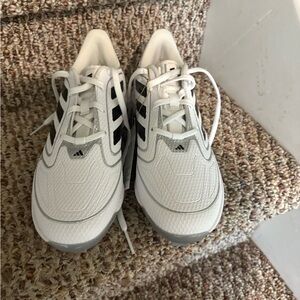 Girls Softball Adidas White and Black Cleats are Spikes
